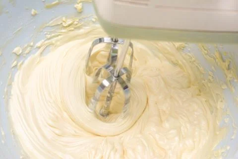Cream is mixing using mixer Stock Photos