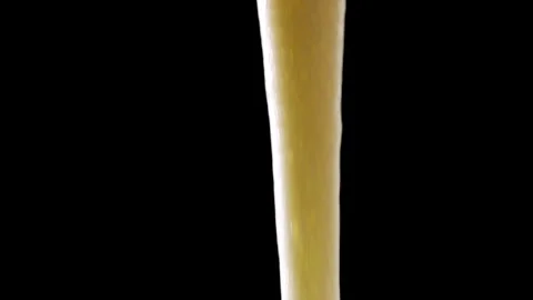 Cream is poured on a black background Video stock 147659289