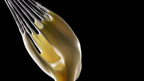Cream is poured on a black background Stock Footage 150776396