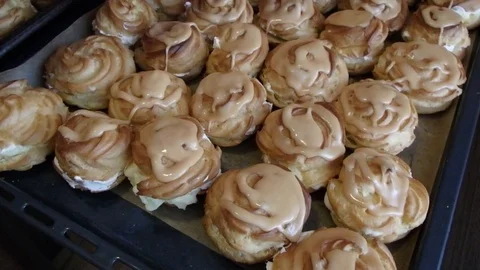 Cream puff rings cakes (eclair) Stock Footage 84117101