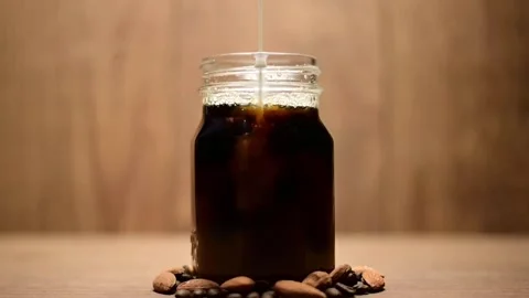 Cream Splash In Coffee Slow Motion Stock-Footage 138539779