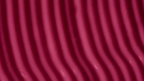 Cream texture with a pattern of stripes and furrows in red color. Face or body Stock Footage 259306637