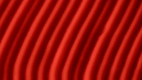 Cream texture with a pattern of stripes and furrows in red color. Face or body Foto stock