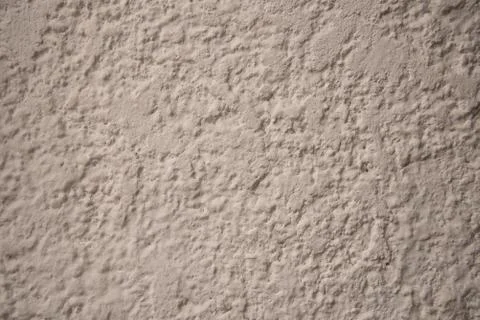 Cream wall texture background. Close-up, pastel colors. Stock Photos