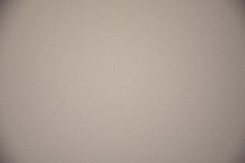 Cream wall texture background. Close-up, pastel colors. Stock Photos