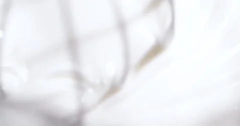 Cream is whipped to a thick consistency for baking and cooking in a kitchen Stock Footage 325087798