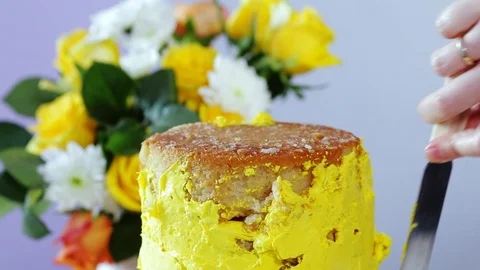 Creaming the multi-layered cake with yellow cream using confectionery spatula. Stock Footage 102043009