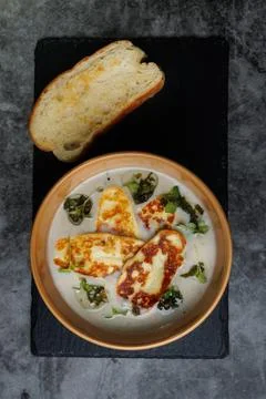 Creamy Cheese Soup, Garnished with Herbs and Melted Cheese Stock Photos