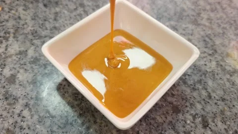 Creamy dipping sauce served in a small bowl at a Chinese restaurant, food d.. Video stock 337323306