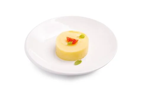 Creamy mashed potatoes served with simple garnish on white plate. Stock Photos
