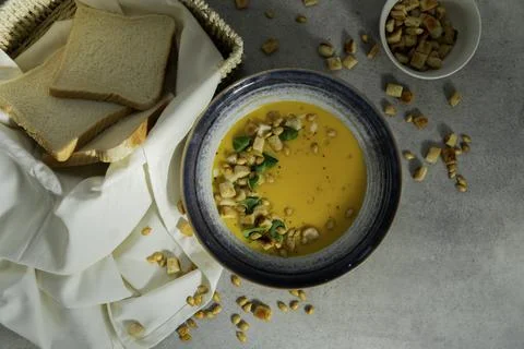 Creamy pumkin soup with croutons Stock Photos