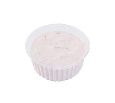 Creamy ranch dip in plastic container Stock Photos