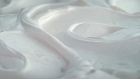 Creamy smooth yogurt texture closeup, 4K slow motion 60fps top table foodstyle Video stock 318475514