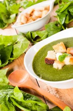 Creamy soup with dried crusts Stock Photos