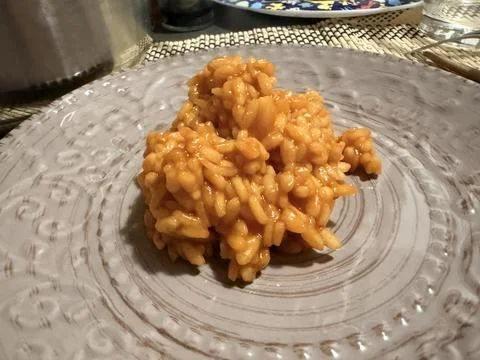 Creamy Tomato Risotto on Ceramic Plate Stock-Fotos