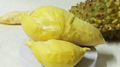 Creamy yellow durian fruit pulp. Stockbeeldmateriaal 339338100