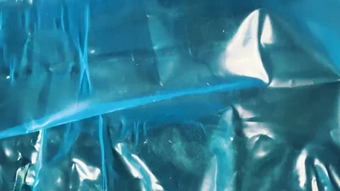 Creased blue plastic wrap surface texture background Stock Footage 340581183