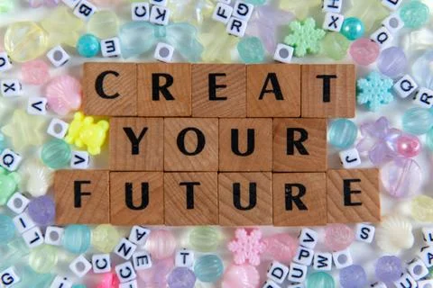 Creat Your Future message with wooden letter tiles and colorful beads Stock Photos