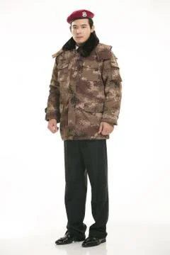 Create all kinds of work clothes policeman stands in front of a white background Stock Photos