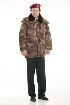 Create all kinds of work clothes policeman stands in front of a white background Stock Photos