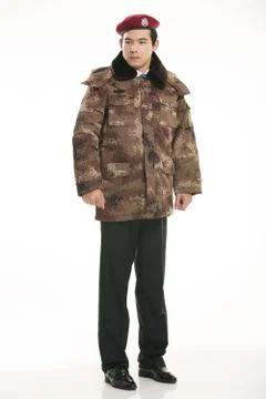 Create all kinds of work clothes policeman stands in front of a white background Stock Photos