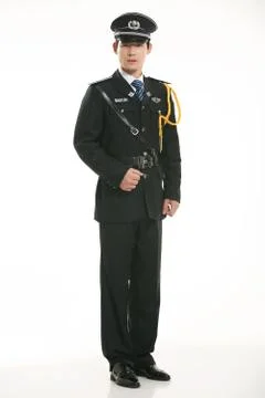 Create all kinds of work clothes policeman stands in front of a white background Stock Photos