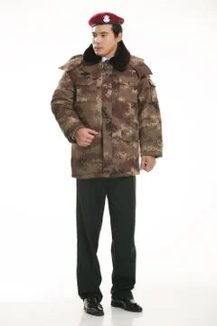 Create all kinds of work clothes policeman stands in front of a white background Stock Photos