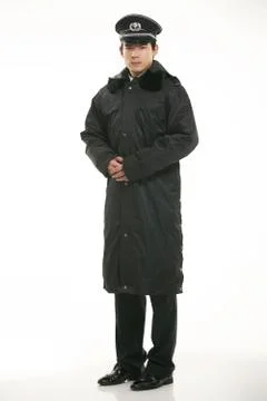 Create all kinds of work clothes policeman stands in front of a white background Stock Photos