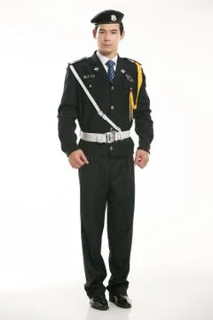 Create all kinds of work clothes policeman stands in front of a white background Stock Photos