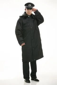 Create all kinds of work clothes policeman stands in front of a white background Foto stock