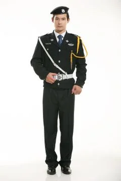 Create all kinds of work clothes policeman stands in front of a white background Stock Photos