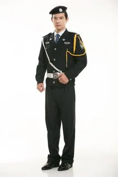 Create all kinds of work clothes policeman stands in front of a white background Stock Photos