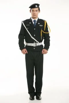 Create all kinds of work clothes policeman stands in front of a white background Stock Photos