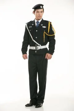 Create all kinds of work clothes policeman stands in front of a white background Foto stock