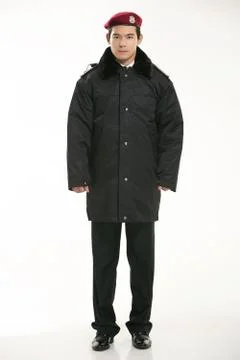 Create all kinds of work clothes policeman stands in front of a white background Stock Photos