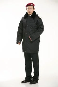 Create all kinds of work clothes policeman stands in front of a white background Stock Photos