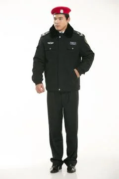 Create all kinds of work clothes policeman stands in front of a white background Stock Photos