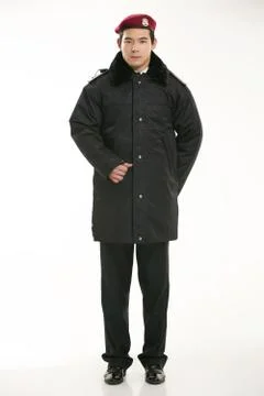 Create all kinds of work clothes policeman stands in front of a white background Stock Photos