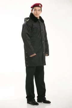 Create all kinds of work clothes policeman stands in front of a white background Stock Photos