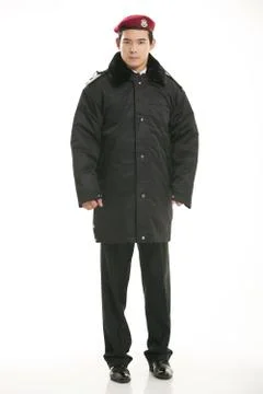 Create all kinds of work clothes policeman stands in front of a white background Stock Photos