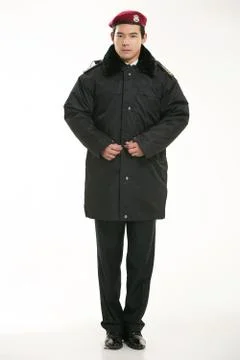 Create all kinds of work clothes policeman stands in front of a white background Stock Photos