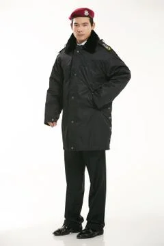 Create all kinds of work clothes policeman stands in front of a white background Stock Photos