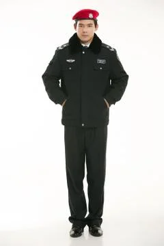 Create all kinds of work clothes policeman stands in front of a white background Stock Photos