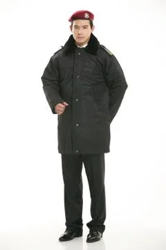 Create all kinds of work clothes policeman stands in front of a white background Stock Photos