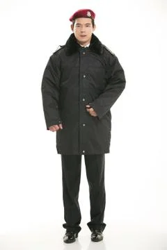 Create all kinds of work clothes policeman stands in front of a white background Stock Photos