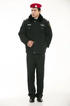 Create all kinds of work clothes policeman stands in front of a white background Stock Photos
