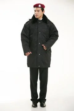 Create all kinds of work clothes policeman stands in front of a white background Stock Photos