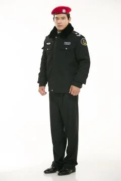 Create all kinds of work clothes policeman stands in front of a white background Stock Photos