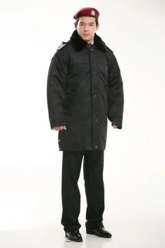 Create all kinds of work clothes policeman stands in front of a white background Stock Photos