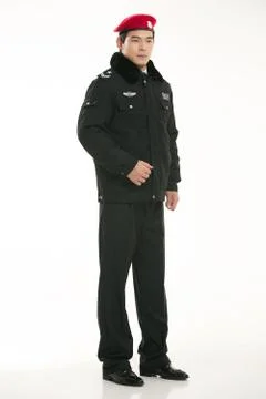 Create all kinds of work clothes policeman stands in front of a white background Stock Photos